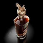 Ducks Unlimited logo overlaying a bottle of premium Kentucky Bourbon celebrating conservation efforts.